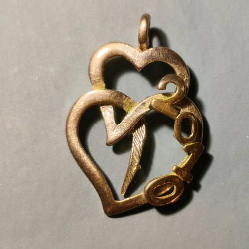 Silver necklace with two hearts and 2010 date used