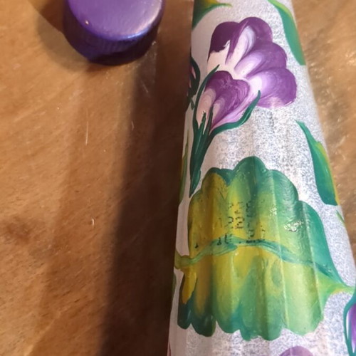 Hand-painted bottle used with embossed patterns