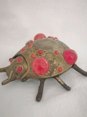 Bronze ashtray used with red scarab-shaped stones