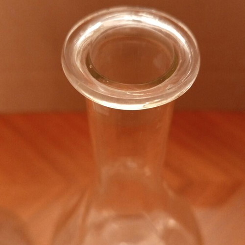 Vintage glass carafes with engraved floral design, pair