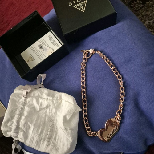 Guess steel necklace used, pink gold heart shape