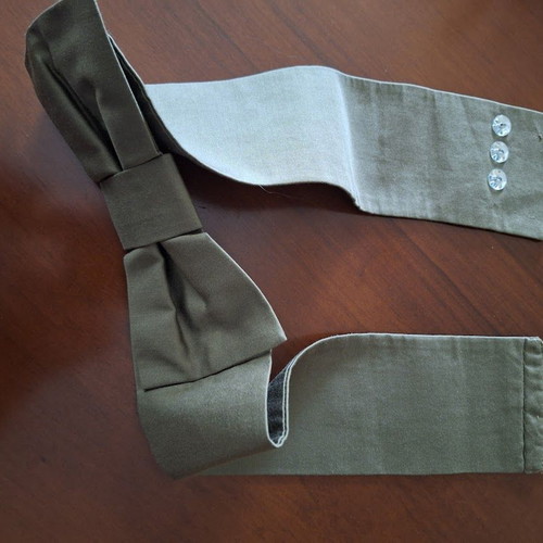 Fabric belt used, green with large bow
