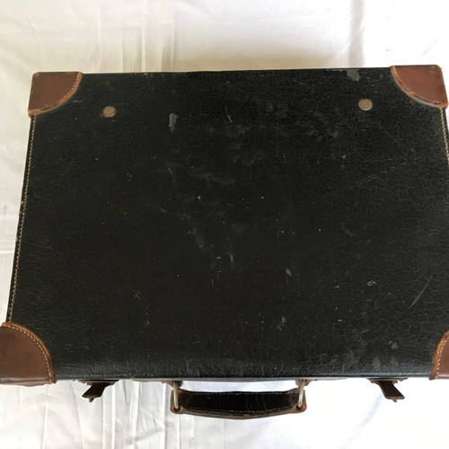 Small antique suitcase used with wear