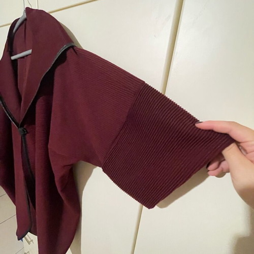 Cape-style coat used with sleeves and hood burgundy