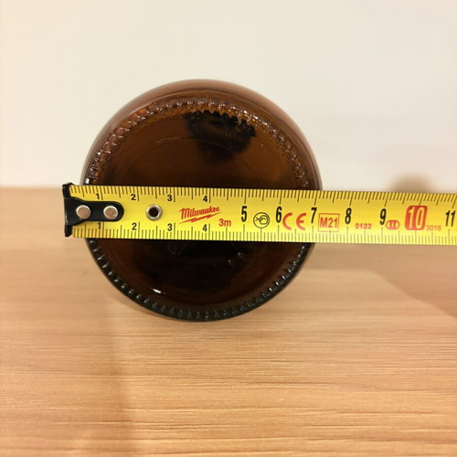 Brown glass pharmacy-style bottle with cap