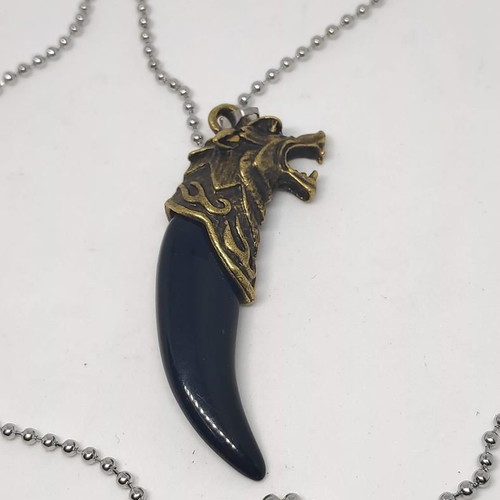 Necklace with wolf tooth pendant like new, gold and black