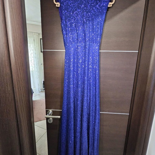 Diamond blue dress like new, open back with shoulder pads