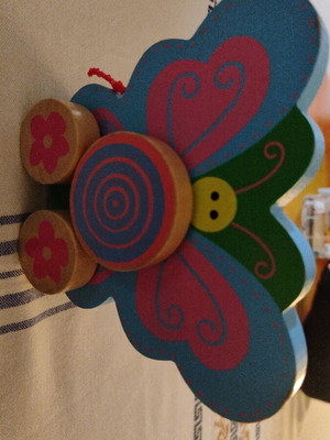 Wooden butterfly with wheels used, wooden toy