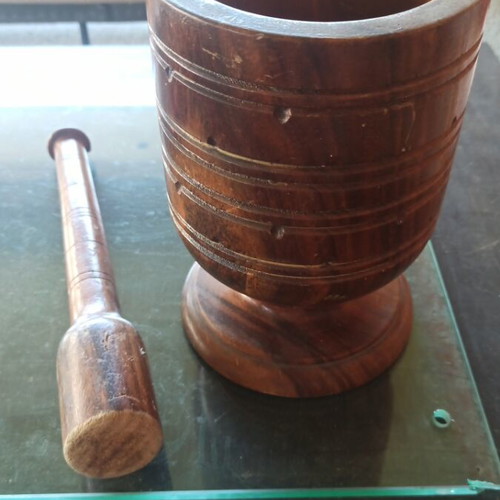Handmade antique wooden mortar and pestle used