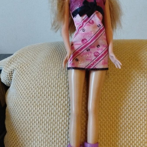 Barbie doll like new with purple dress and gold necklace from 2009 collection