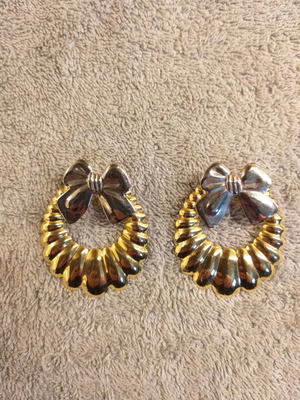 Metal earrings with bow used, silver and gold color