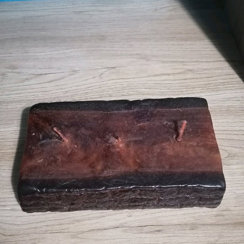 Handmade candle in wood log shape like new