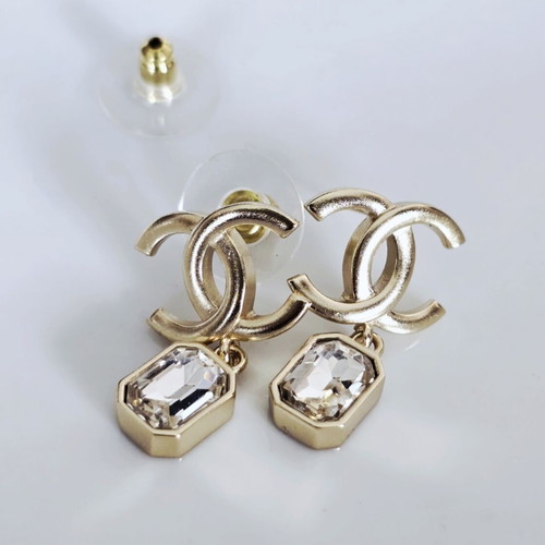 Chanel earrings with white and gold details