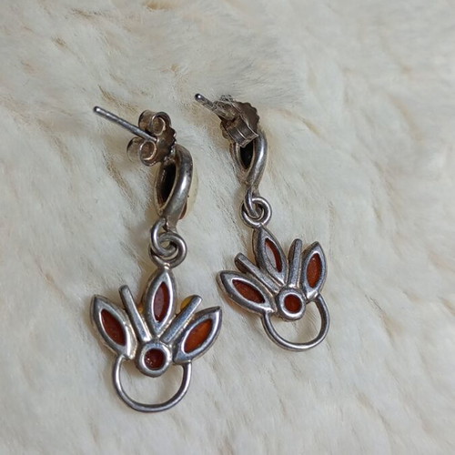 Silver earrings with amber used