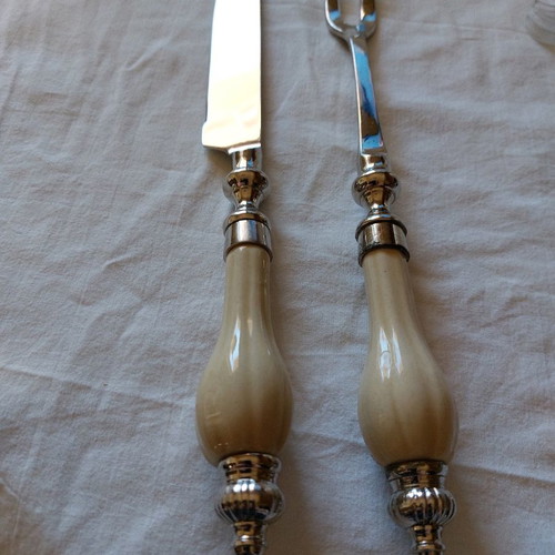 Meat serving knife and fork used, silver-plated with porcelain handles from England