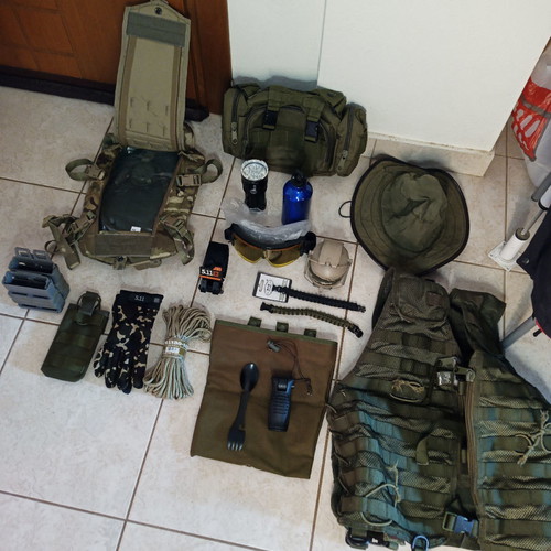 Tactical pack used, assorted gear items