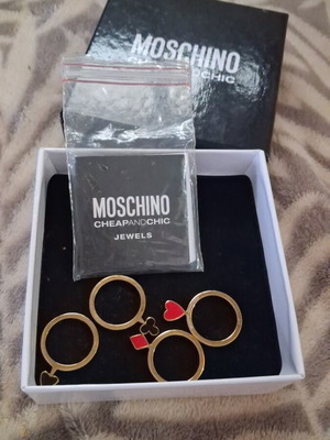 Moschino ring set gold color like new, 4 pieces