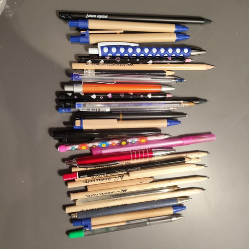 Set of pens and pencils used, some promotional