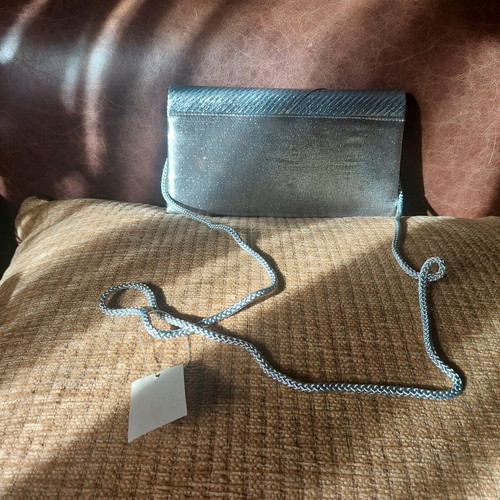 Vintage silver envelope hand bag like new with strap
