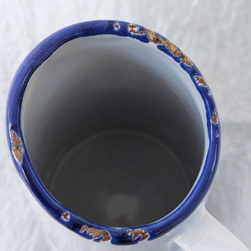 Ceramic jug like new resembling oxidized tin vessel