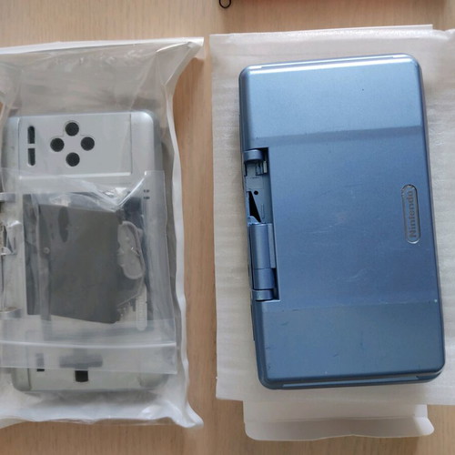 Nintendo DS (2004) console used with 2 games, charger, and accessories