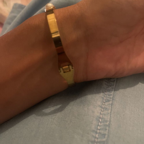 Steel bracelet used, gold color with meander design, crystals and pearls