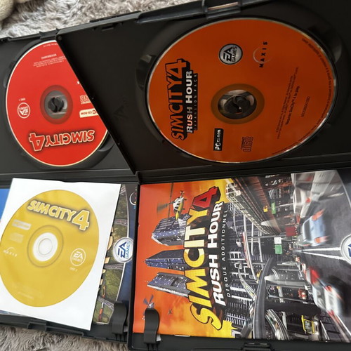 Sim City 4 and Sim City Rush Hour 4 PC games like new, complete with manual