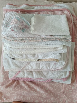 Baby towels used, white with pink and beige