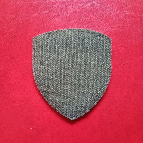 Collectible military uniform badge with national emblem, like new