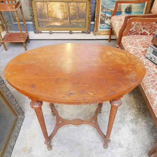 Vintage oval wooden coffee table used with brass feet