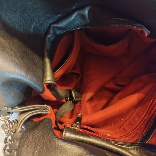 Black shoulder bag like new, synthetic leather with silver chains