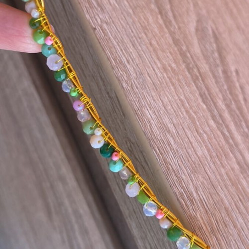Handmade crown of gold wire with colorful beads