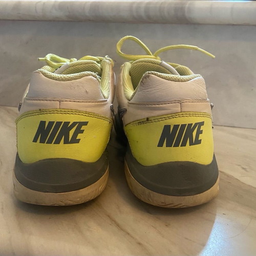 Nike athletic shoes used, white yellow, size 38