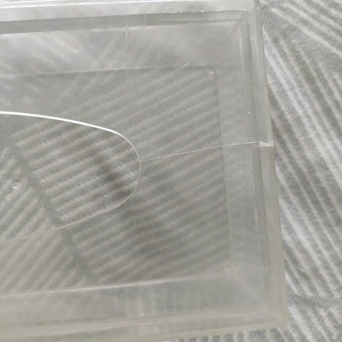 Plastic tissue box used, slightly cracked