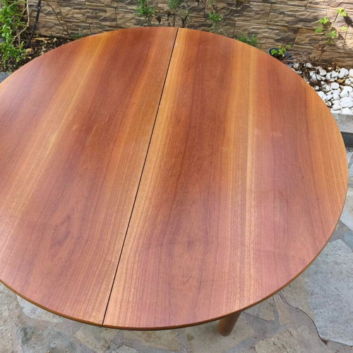 Wooden extendable round dining table used