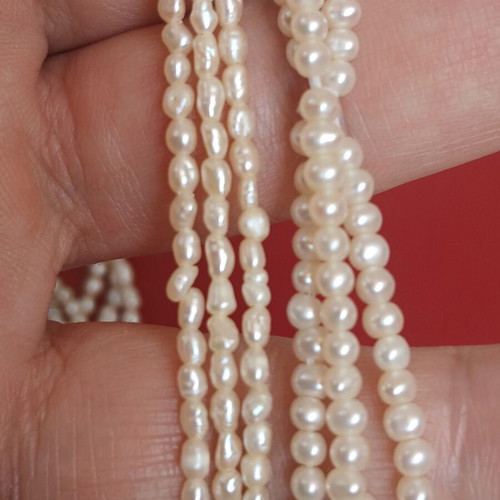 Two freshwater pearl necklaces with gold and metal clasps