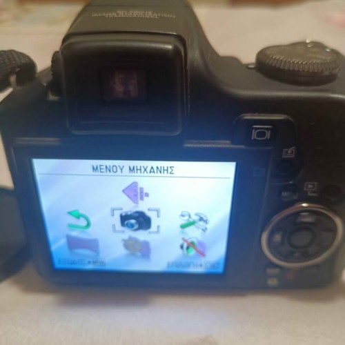 Olympus SP590UZ digital camera used, 26x zoom, retro style