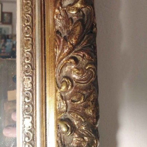 Antique mirror used with carved frame in gold crackle finish