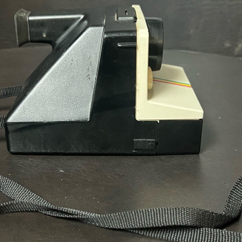 Vintage Polaroid One Step SX-70 camera and film used, white with rainbow stripe