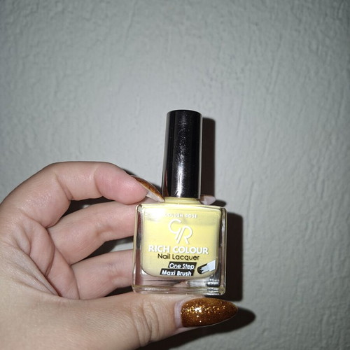 Nail polish butter yellow used, over 70% full