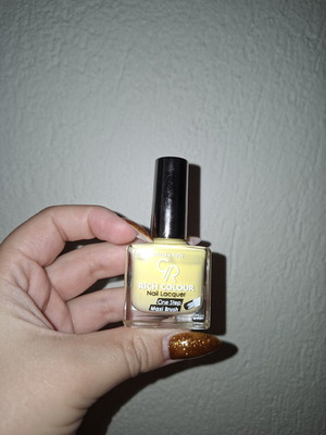 Nail polish butter yellow used, over 70% full