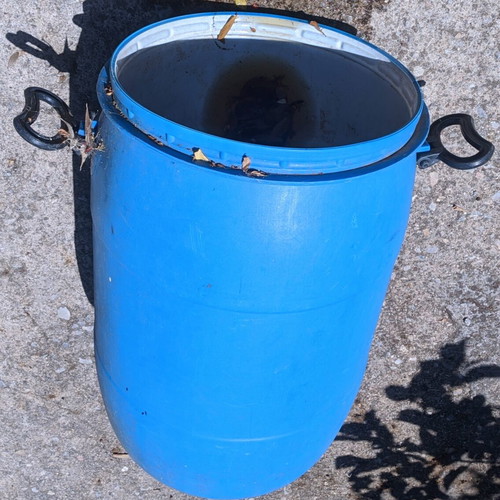 Plastic barrel like new with lid and handles