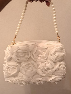 Women's evening handbag like new with rose design, metal chain and pearls