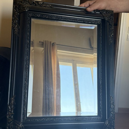 Woodcarved mirror with brass details used