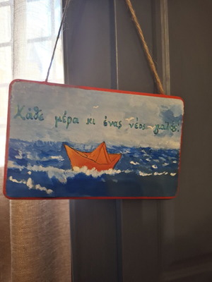 Handmade wooden sign "Every day a new shore"