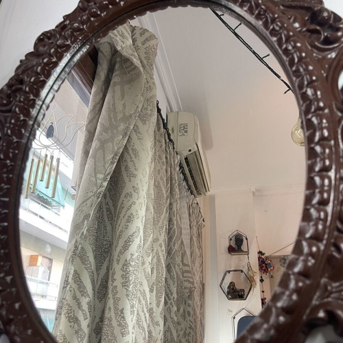 Vintage oval wall mirror with embossed frame