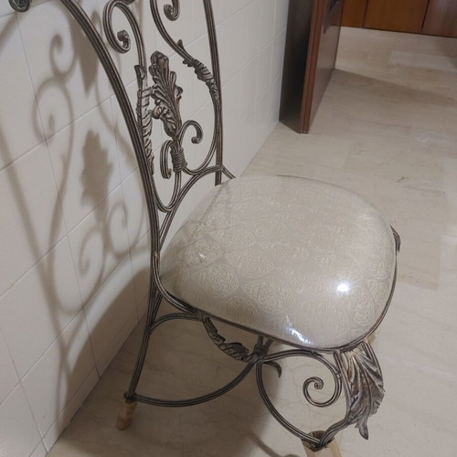 Set of 2 wrought iron dining chairs with decorative leaf details