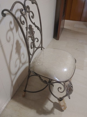 Set of 2 wrought iron dining chairs with decorative leaf details
