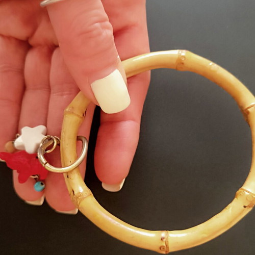 Bamboo bangle with tiki charms like new
