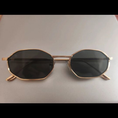 Red Raven sunglasses with gold frame, black lenses